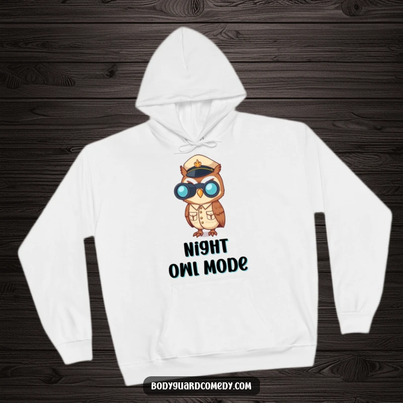 Funny hoodie with a vigilant owl in a crisp uniform, binoculars raised, embodying alertness and a humorous sense of duty.